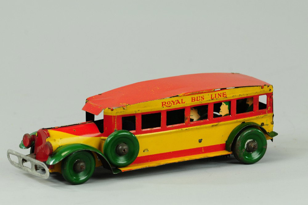 ROYAL BUS LINE: Louis Marx, lithographed tin, done in yellow, red and green, blue trunk, disc wheels, reads "Royal Bus Lines," on sides, clockwork driven. 10" l.