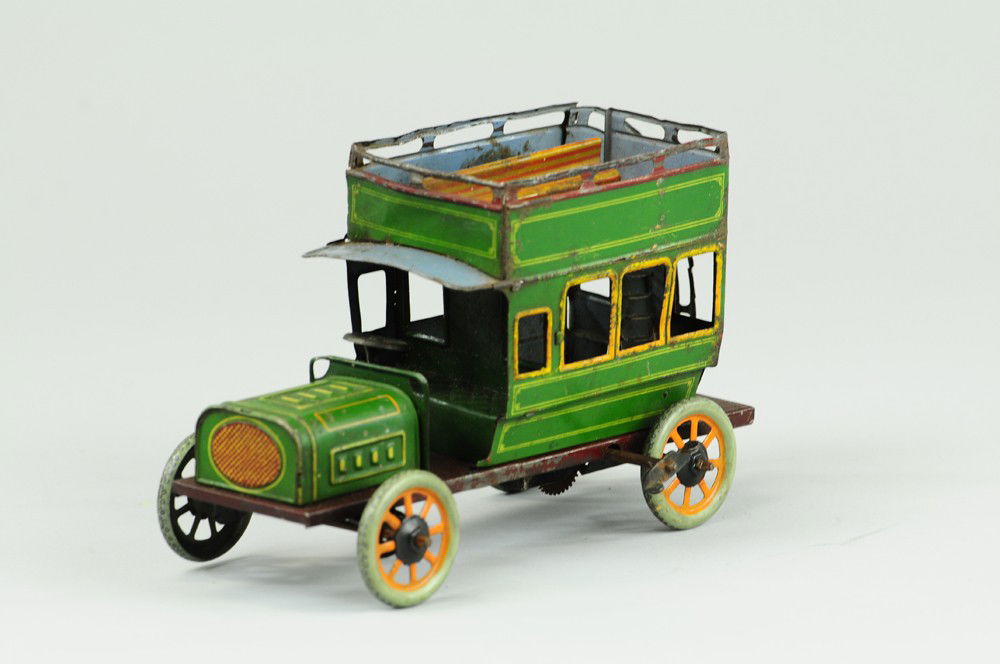 BING DOUBLE DECKER BUS: Germany, lithographed tin, done in green body, railed upper deck with bench seating, clockwork driven, rear stairway. 7 1/4" l.