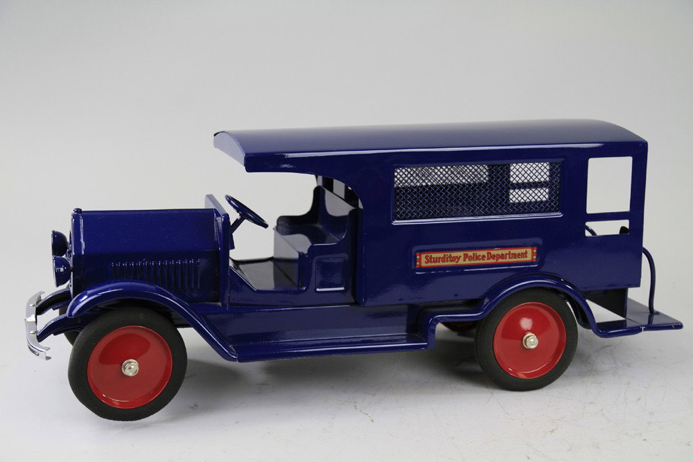 STURDITOY POLICE DEPARTMENT: C. 1920's, pressed steel, beautiful bright blue color, familiar paddy wagon mesh side van body truck. 26" l.