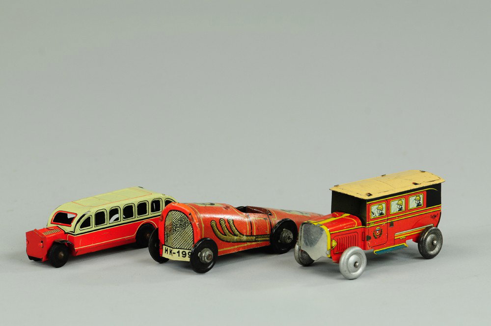 LOT OF THREE PENNY TOY VEHICLES: Lithographed tin, assorted lot includes French fire patrol van, German race car "Jo Haku," and German inter-urban bus, all lithographed in tin. 3 1/4"-4 1/2"