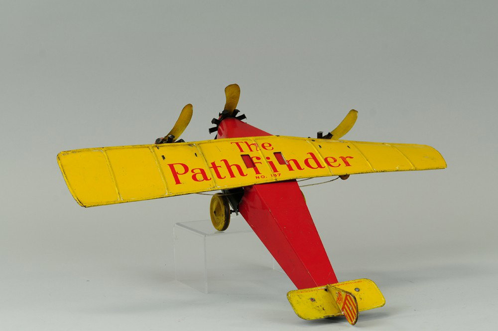 KATZ TOYS "PATHFINDER" TRI-MOTOR: Lithographed tin, done in red fuselage, yellow wing, tri-motor airplane, disc wheels, key wind operated. 21" wingspan.
