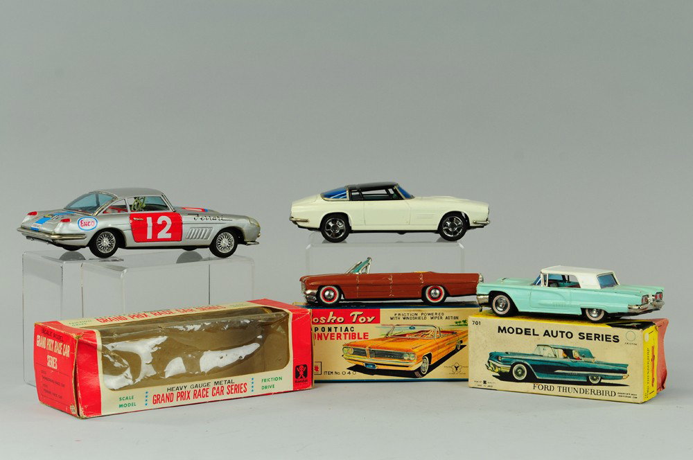 FOUR JAPANESE TIN AUTOS: Friction autos done in lithographed tin, includes: Ford Thunderbird, Pontiac Convertible, Grand Prix Race Car, and Mustang. 8" to 10 1/2"l.