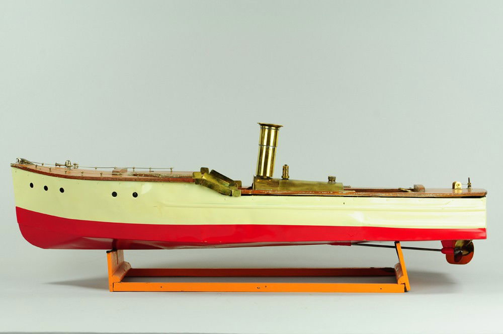 LARGE STEAM LAUNCH: Pressed steel hull, painted in white and red, wooden deck, brass steam boiler, railed bow, impressive scale. 31 1/2" l.