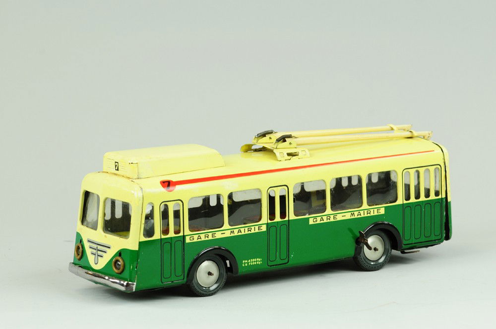 JOUSTRA INTERURBAN BUS: France, lithographed tin, electric lights, seated driver, rods on roof, clockwork action with celluloid windows. 14" l.