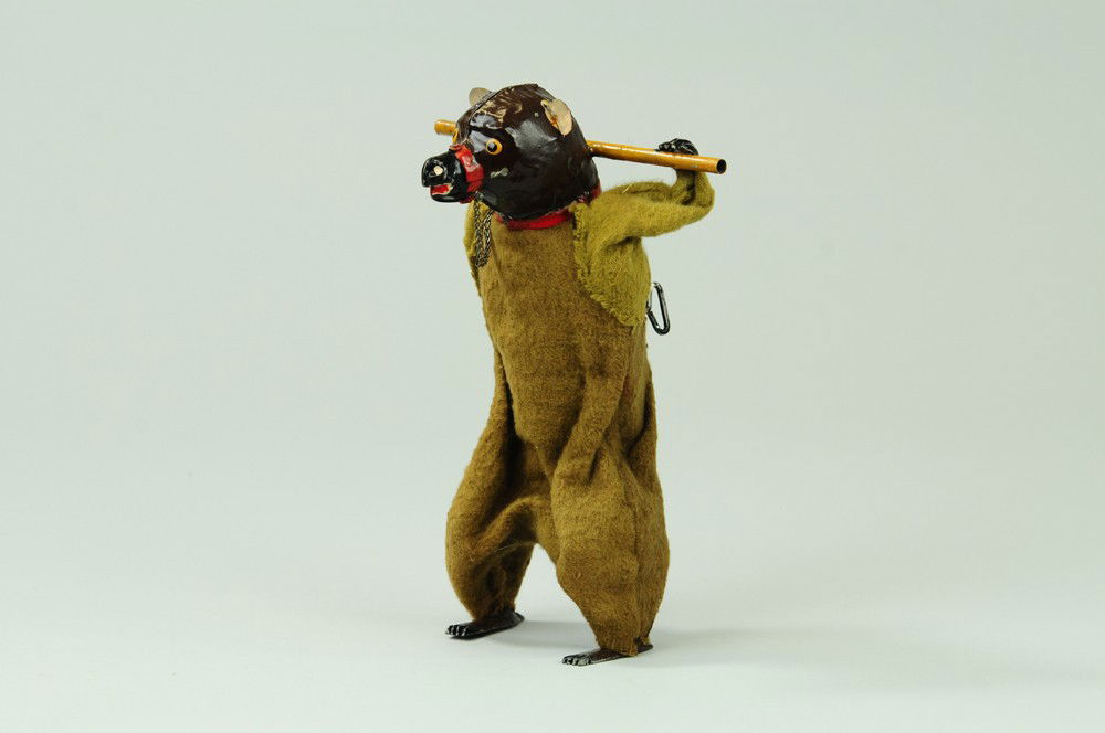 MECHANICAL DANCING BEAR: Gunthermann, Germany, hand painted in brown, tin bear able to wobble about when clockwork is activated. 8" h.