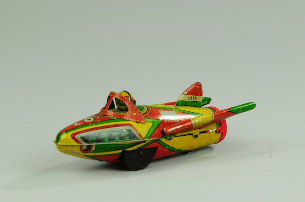 PRE-WAR JAPANESE ROCKET SHIP: Kaka, Japan, lithographed tin, interesting spelling, marked "SUPPER ROCKET," friction powered, emits loud popping noise. 7 1/2" l.
