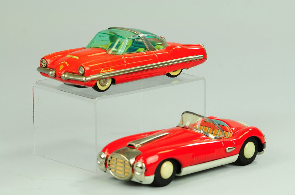 LOT OF TWO SPORT CARS: Japan, both done in lithographed tin, includes scarce Lincoln Concept car in red with full plastic roof and red Cunningham 1960's coupe with cool grille. 7 1/4" l.