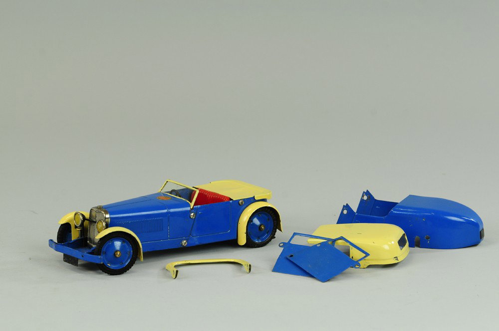 MECCANO TWO SEAT SPORTS CAR: England, c. 1930's, beautiful blue and yellow open sports car with red embossed seating, celluloid in windshield, nickel grille and clockwork mechanism, this is their constructional model, comes with 