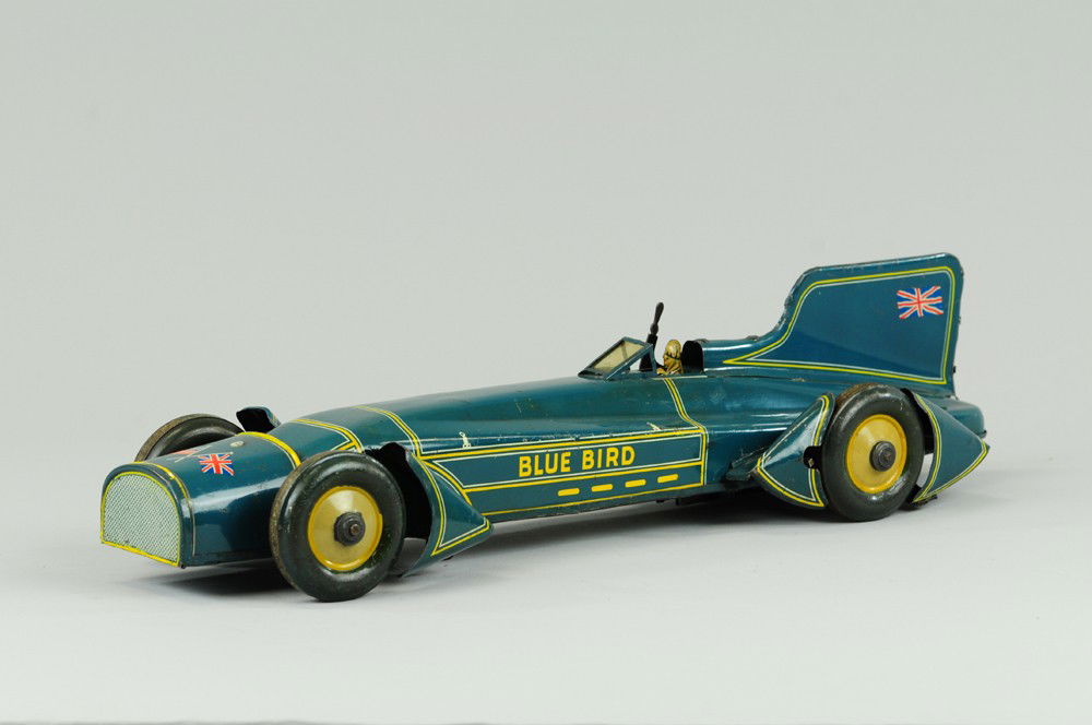 GUNTHERMANN BLUEBIRD RACER: The famous Captain Campbell's world record holder, lithographed tin, sleek and impressive design, done in familiar blue, extensive striping, classic high tail fin, clockwork driven. 19 3/4" l.