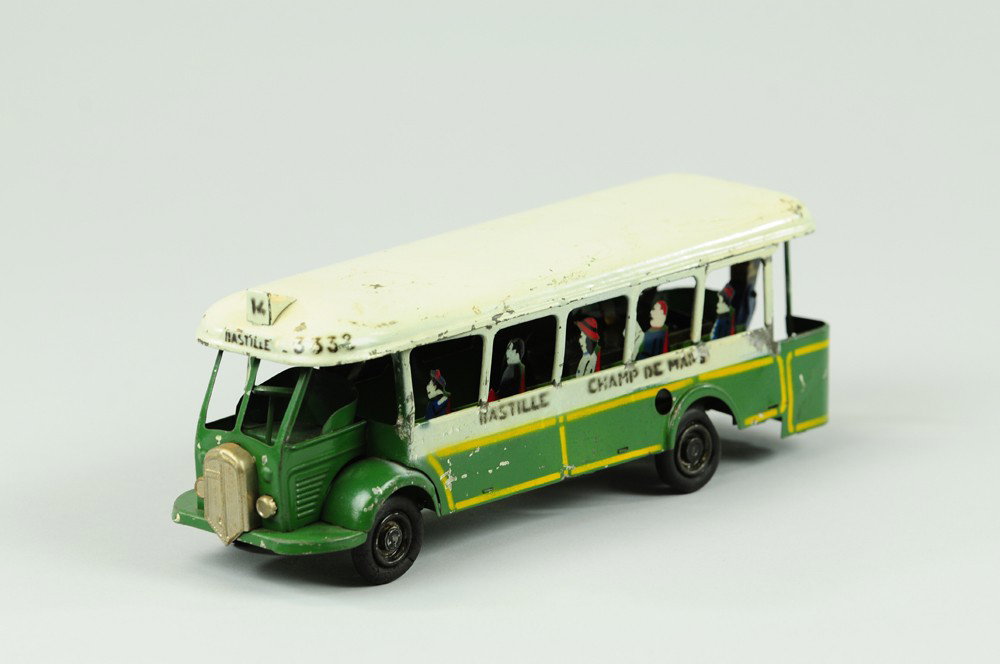 INTER URBAN FRENCH BUS: Lithographed tin, done in classic white and green body, destinations stenciled on sides for "Bastille" clockwork driven, full passenger interior. 8 3/4" l.