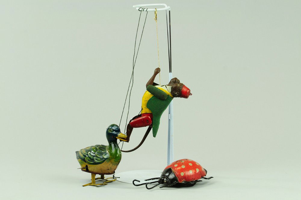 TIN ANIMAL TOY LOT: Assorted toy group includes Lehmann Climbing Monkey, Ebo Walking Duck and Gunthermann Beetle.