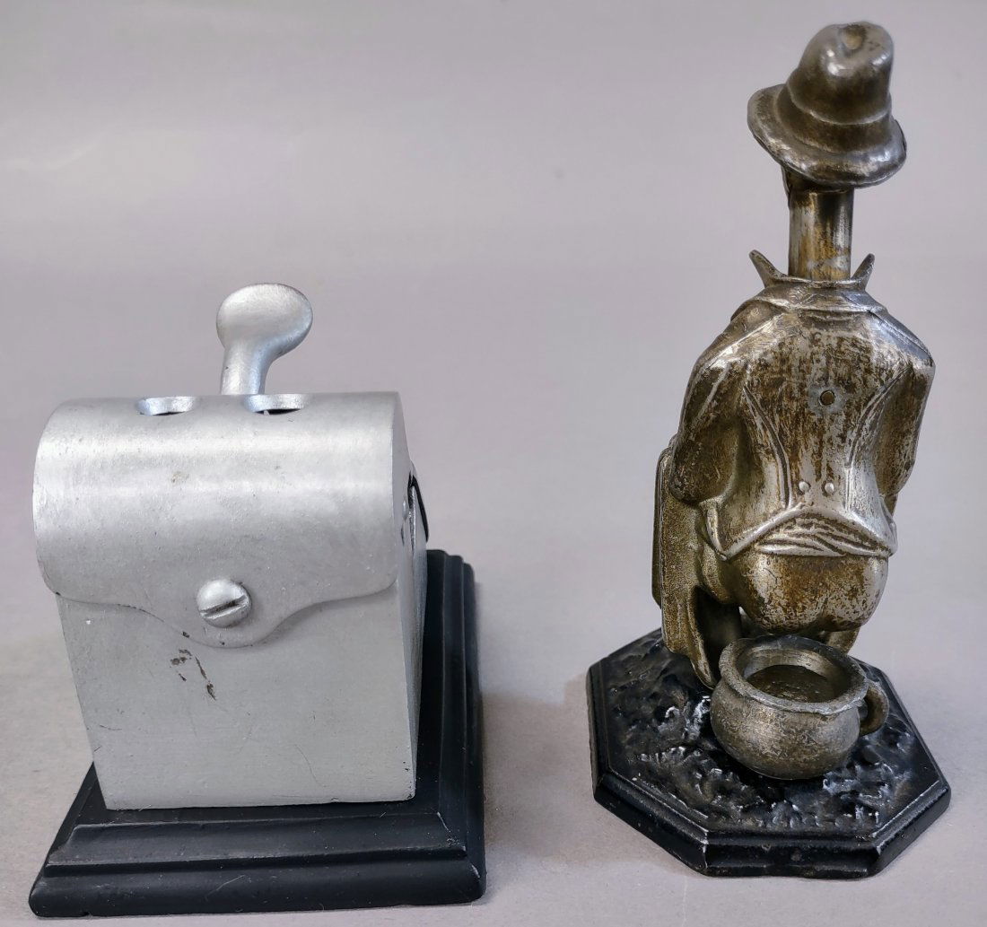 TWO ANIMATED CIGAR CUTTERS