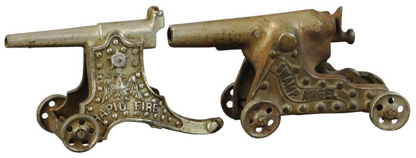 RAPID FIRE & SWAMP ANGEL IRON CANNONS: 449. RAPID FIRE & SWAMP ANGEL IRON CANNONS | Kenton Hardware Co. Both embossed with nice detail. The Schroeder Collection - Abbys Attic Finds 6" l. Rapid fire is missing the hammer, (Very Good to Exce