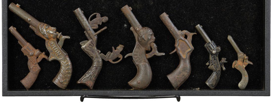 GROUPING OF SEVEN CAP PISTOLS (1 of 2)