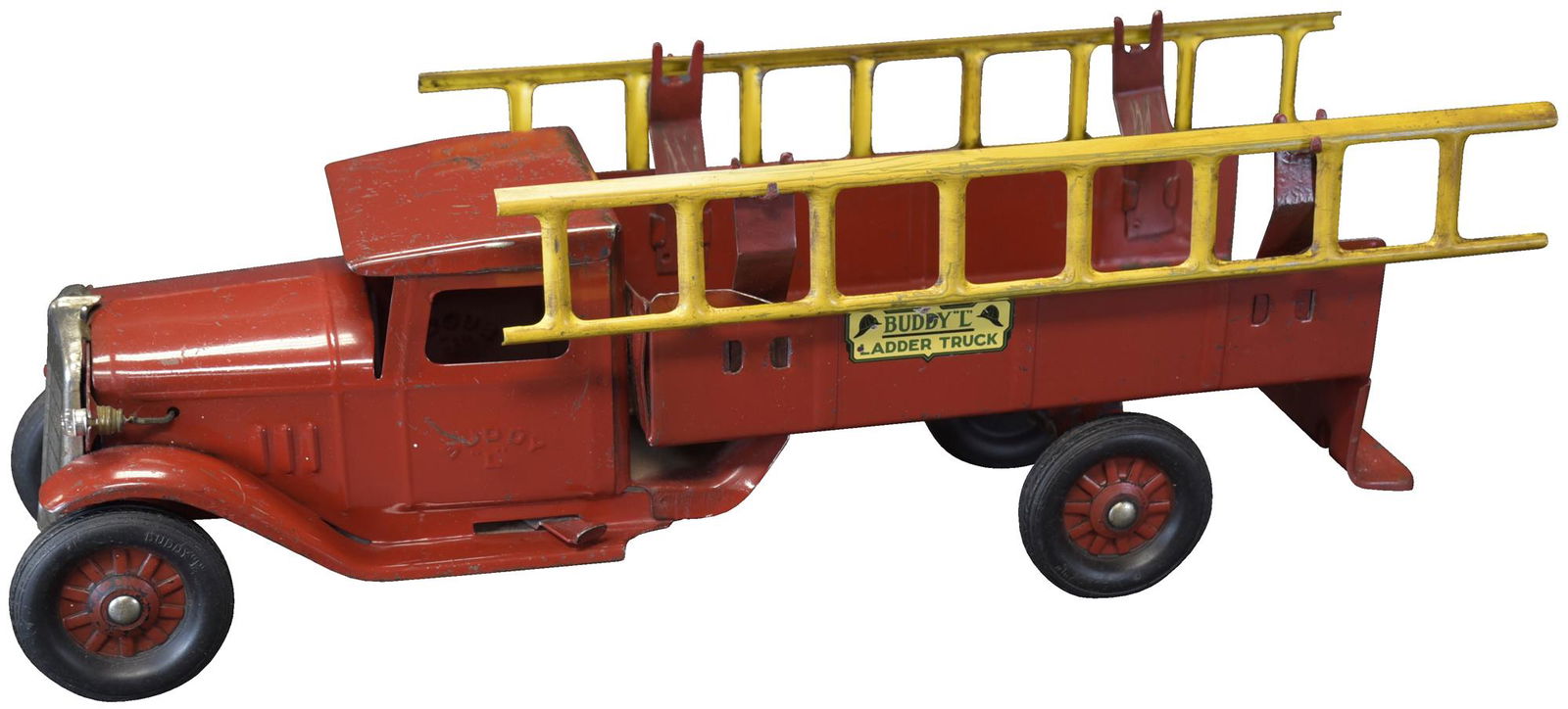 BUDDY L LADDER TRUCK: 527. BUDDY L LADDER TRUCK | Buddy L stamped onto side of door. | 22" l. | Ladders and their brackets are added, otherwise in (Excellent to Pristine Condition) other than some typical playwear. | $400