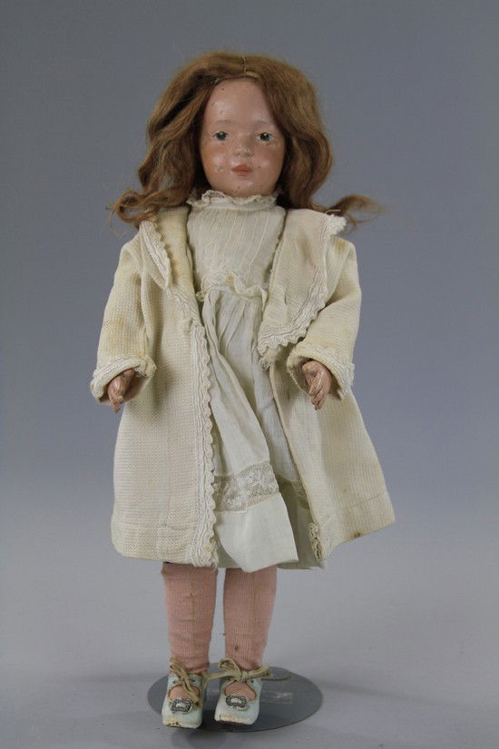 SCHOENHUT CHILD DOLL: Fully jointed wooden doll with Schoenhut decal sticker on torso, painted blue intaglio eyes, relaxed antique mohair wig, weathered antique clothing and shoes and original Schoenhut union suit. Paint c
