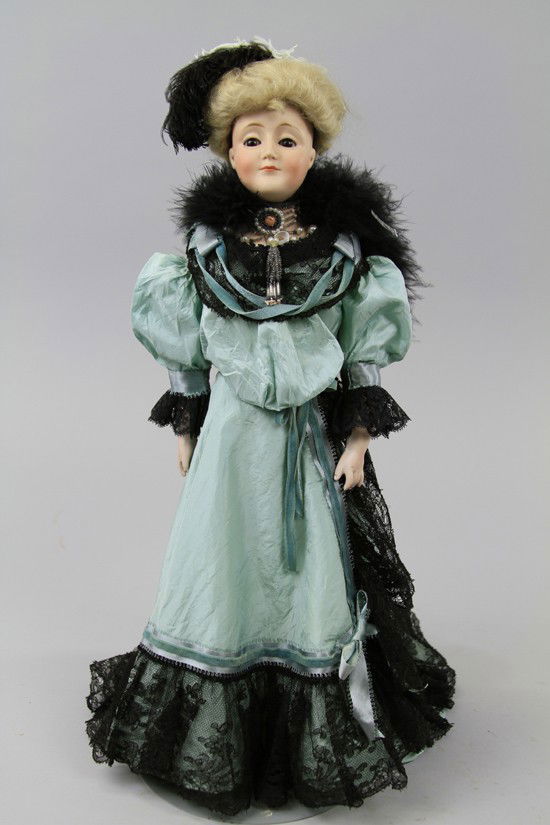 OUTSTANDING KESTNER "GIBSON GIRL": Bisque shoulder head incised "Made in Germany 172," with brown glass sleep eyes, closed mouth, protruding chin, on original leather body with joints at elbows, hips and knees, bisque forearms, she wea