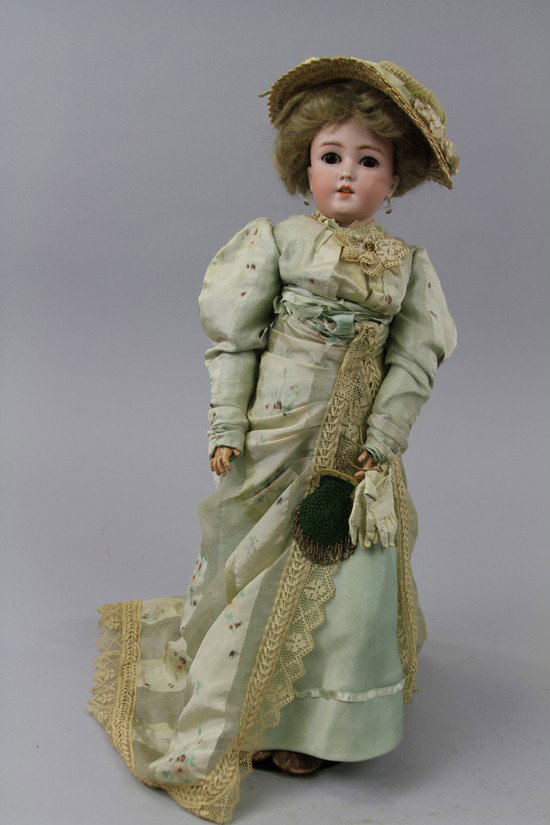SIMON HALBIG EDWARDIAN ERA LADY DOLL: Narrow faced doll incised "1159 Germany S&H 8," with open mouth and four upper teeth, blue glass sleep eyes, painted lower lashes, original silk upper lashes, on original fully jointed German lady bod
