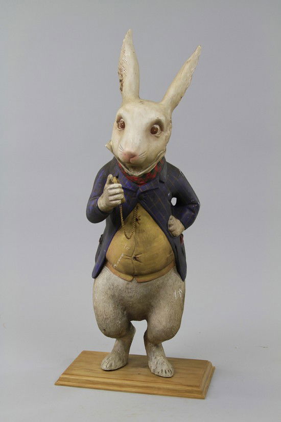 RABBIT IN SUIT STORE DISPLAY: Full figure example, appears to be a composition bodied rabbit in fancy attire holding a pocket watch; reportedly found in a London store front and scale would make it an ideal trade stimulator. 27" t