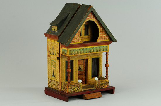 BLISS "KEYHOLE" DOLLHOUSE: Two room house, features celluloid windows with lace curtains, original interior papers, exterior lithographed paper over wood. 16" h.