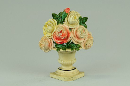 ROSES DOORSTOP: Hubley, cast iron, lovely pastel arrangement simulated in classic style white vase, rare. 8 3/4" h x 7 7/8" w.