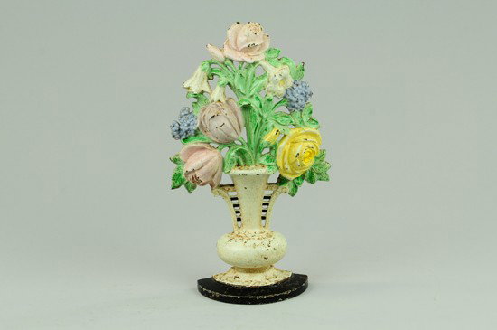 TULIPS AND ROSES DOORSTOP: "Hubley, Made in USA, 465," elegant pastel colored tulips and roses in ornate white vase. 10 3/8" h x 6 1/8" w.