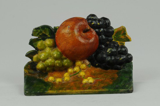 APPLE AND GRAPES DOORSTOP: Charming presentation of amber apple surrounded by purple, green and yellow grapes. Book Example. 4 3/4" h x 7 3/8" w.