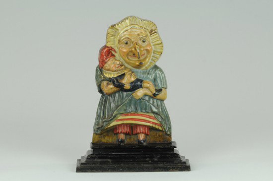 JUDY DOORSTOP: English, two piece casting, shows familiar character Judy coddling the baby Punch, Book Example. 12 1/8" x 8".