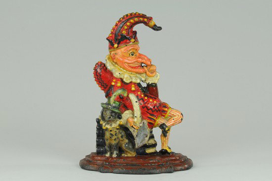 PUNCH DOORSTOP: Depicts the famed English character in whimsical pose, very colorful, dog cast at side of chair. 12" x 7 1/4".