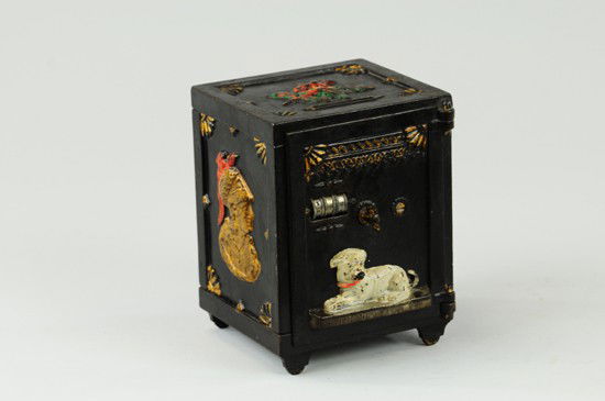 WATCHDOG SAFE MECHANICAL BANK: J & E Stevens Co., circa 1880. Insert a coin in the slot and lift the lever; the coin falls into the bank as the dog opens his mouth and barks (Internal bellows operated squeaker). Release the lever a