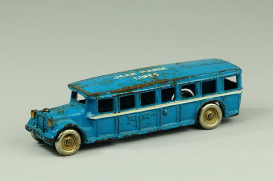FAGEOL BUS WITH PRIVATE LABEL: Arcade, cast iron, done in blue overall, roof stenciled "Jean Marie Lines," classic styling with flat roof and open windows, nickel plated disc wheels. 8" l.