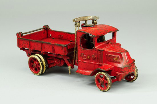 MACK T-BAR DUMP TRUCK: Arcade, cast iron, done in red overall, silver t-bar pulley system for raising dump, embossed 'Mack' on cab sides. 12" l.