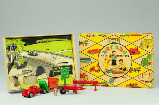 BOXED ROAD CONSTRUCTION SET NO. 4329: Arcade, cast iron set includes dump truck, wheelbarrow, danger signs and nickel tools, insert done in lithographed scene. 8 1/4" x 11 1/4".