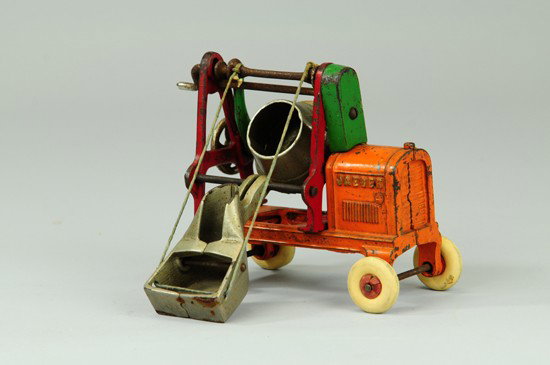 JAEGER CEMENT MIXER: Kenton, cast iron, painted in orange, red and green, nickel plated cast iron mixing drum, white rubber tires, hood embossed "Jaeger." 6 1/2" l.