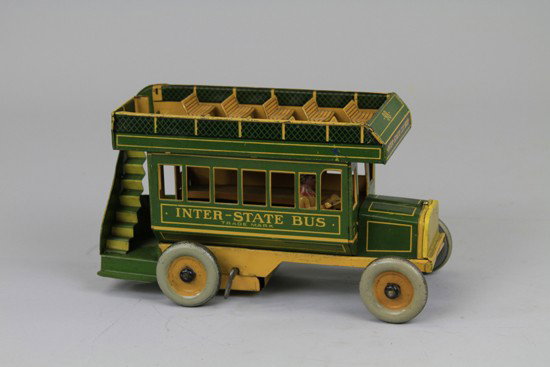 INTERSTATE BUS: Strauss, lithographed tin, done in green and orange color scheme, top level bench seating, rear stairwell, clockwork driven. 10 1/4" l.