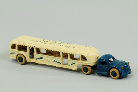 CENTURY OF PROGRESS BUS: Arcade, cast iron, tandem example done in blue and white overall, stenciled "Century of Progress - Chicago 1934," on roof, white rubber tires. 10 1/4" l.