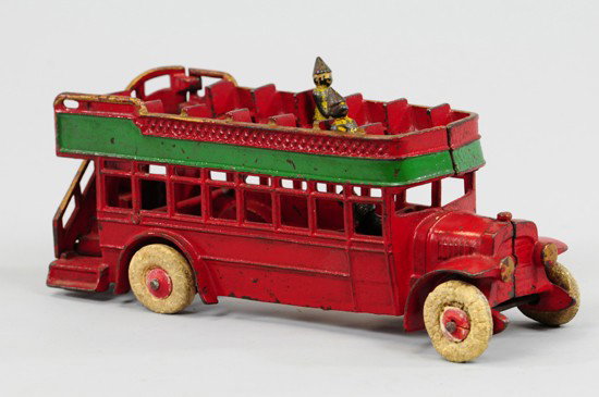 DOUBLE DECKER BUS: Kenton, cast iron, painted in red with green upper band and gold highlights, white rubber tires on red wood hubs. 10" l.