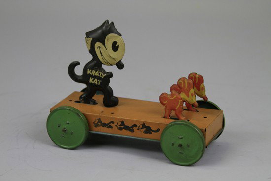 FELIX CHASING MICE PULL TOY: Nifty, copy. Pat Sullivan, very desirable example done in lithographed tin, depicts Felix running after two mice on wheeled platform, amusing and colorful. 7 1/4" l.