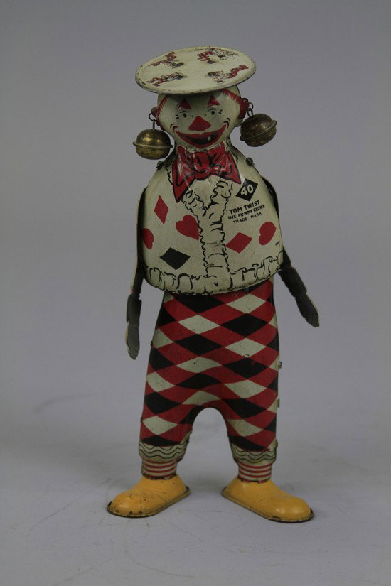 TOM TWIST STAND UP FIGURE: Ferdinand Strauss, lithographed tin, marked Tom Twist the "Funny Clown," wind up action. 8 1/2" h.