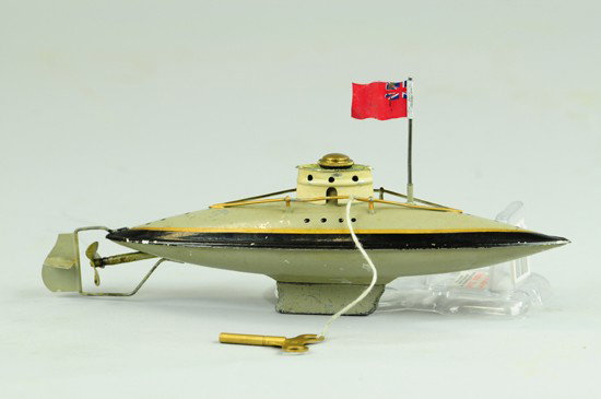 FLEISCHMANN SUBMARINE: Germany, hand painted in grey with black deck trim, white cabin at center, clockwork driven, railed deck, flag added. 9 1/4" l.