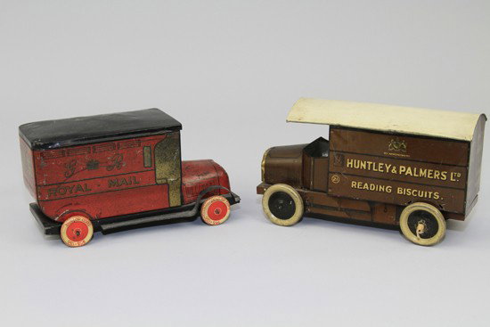 LOT OF TWO DELIVERY VAN BISCUIT TINS: c. 1920's, includes Royal Mail Truck and Huntley & Palmers Reading Biscuits Truck, both with hinged lids, disc wheels. 9" to 10