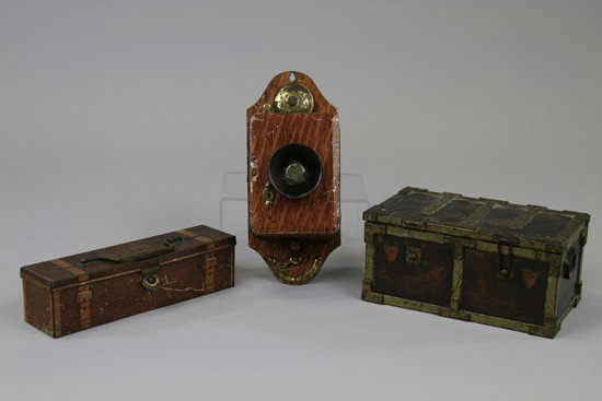 THREE FIGURAL BISCUIT TINS: Lithographed Tinplate comprising Huntley & Palmers "Iron Chest", c. 1907. features simulated brass strapping with intentionally weathered finish. Intended to emulate a strong box, but has the appearan