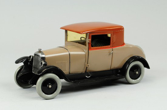 B14 COUPE: Citroen, France, painted in tan body, dark brown roof, clockwork driven, electric lights, opening driver's door, embossed seating, spare on trunk. 16" l.