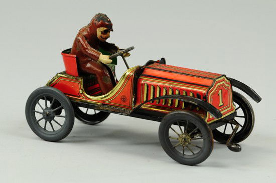 HANS EBERL TWO SEAT TOURER: Germany, lithographed tin, done in red body, seated hand painted body, spoke wheels, clockwork activated from front crank. 8 1/4" l.