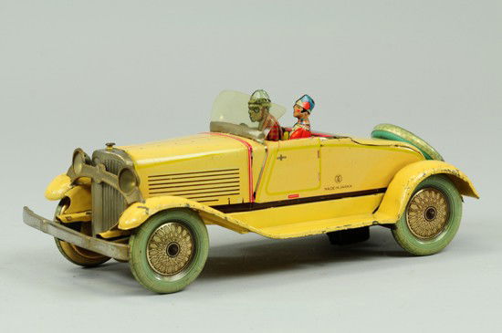 PRE-WAR JAPANESE ROADSTER: Japan, logo uncataloged Y over M, exceedingly rare lithographed tin example, done in yellow body, two seated figures, celluloid windshield, blue and gold balloon wheels with spare on trunk, nickel pla
