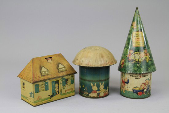 THREE MABEL LUCIE ATWELL BANK BISCUIT TINS: England, c.1935, Crawford Lithographed tinplate, comprising "Fairy Tree" "Bicky House" and "Fairy House" in the form of a mushroom. 7 ½", 14", 5 ½" h.