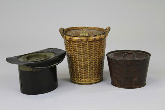 MACFARLANE LANG HATBOX BISCUIT TIN: Scotland/England c. 1910 tinplate lithographed and embossed to simulate dark brown crocodile skin with stitch details and lock. Together with a c. 1905 Huntley & Palmer "Hamper" in brown rattan with w