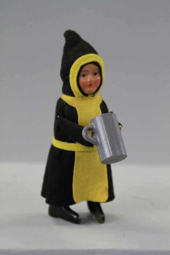 SCHUCO MONK WITH STEIN: Germany, post war example, depicted in black robed outfit, plastic stein, clockwork. 5" h.