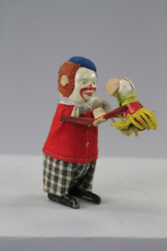 SCHUCO CLOWN DANCING WITH MOUSE: Germany, both tin, each in felt suit, amusing depiction, clockwork driven. 5" h.