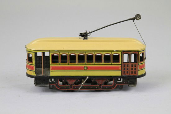 TROLLEY: Gunthermann, Germany, lithographed tin, well detailed street trolley with pole at roof, key wind driven. 8" l.